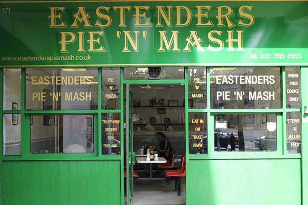 The green shop front of the EastEnders Pie N Mash Shop in Poplar. 