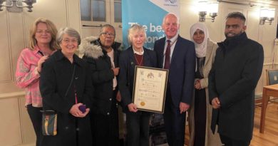 Sister Christine Frost and volunteers from Neighbours in Poplar receiving the Tower Hamlets Freedom Award from Mayor John Biggs.