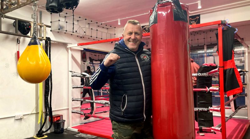 Kirk Whitelock posing next to a punching bag in Aberfeldy Boxing Club.