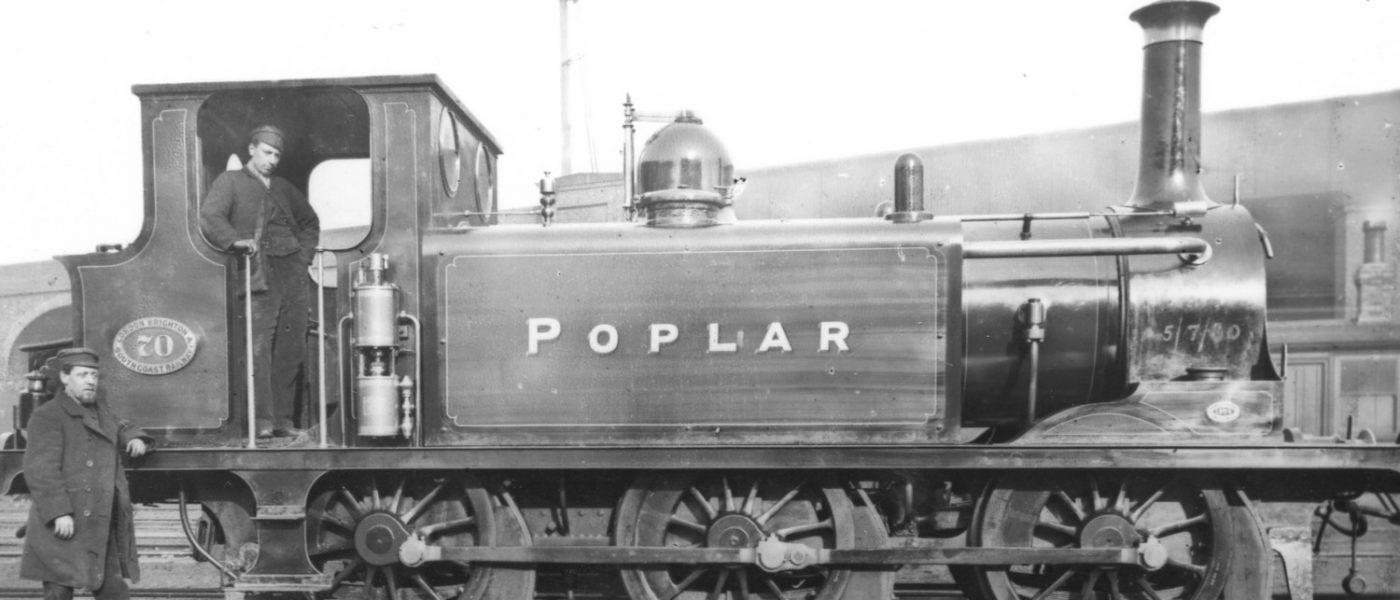 Poplar Victorian steam engine with foremen in depot, 1880