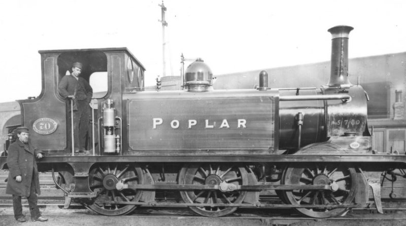 Poplar Victorian steam engine with foremen in depot, 1880