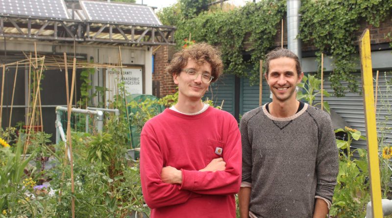 Cameron Bray and Andy Belfield, project coordinators at r-urban, stand in the urban garden at Brion Place, Poplar, East London
