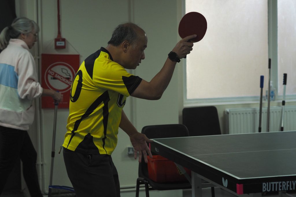 Playing ping pong at the Chinese Association of Tower Hamlets in Limehouse. 