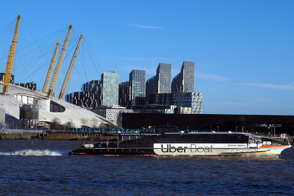 O2 arena and Uber Boat on the Thames seen from The Gun's riverside terrace.