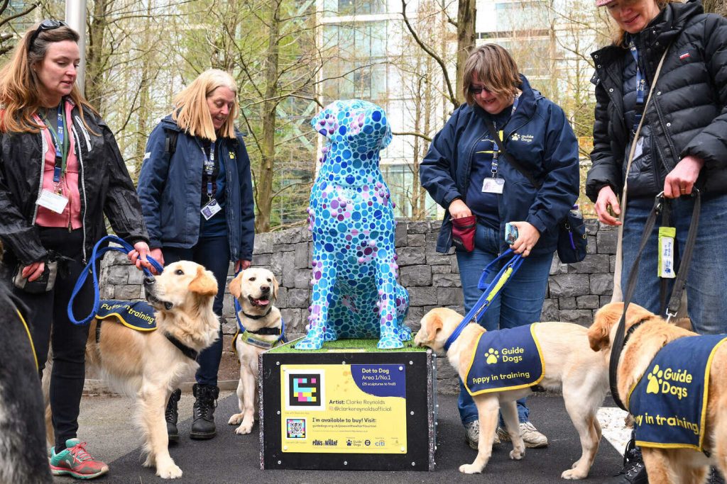 Volunteer Puppy Raisers Louise Roche, Annie Hawkins, Sally Ross, and Annette Fettes and guide dog puppies