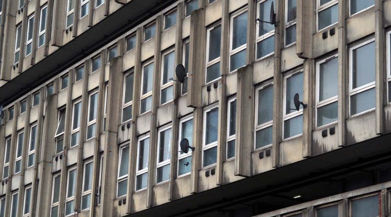 Close up picture of Robin Hood Gardens windows showing the grey concrete and broken windows.
